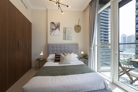 Luxe Apartments near Dubai Mall, Burj Khalifa - Pool, Gym, & Parking by Sojo Stay