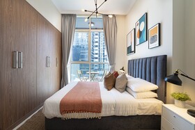 Luxe Apartments near Dubai Mall, Burj Khalifa - Pool, Gym, & Parking by Sojo Stay