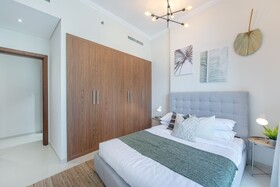 Luxe Apartments near Dubai Mall, Burj Khalifa - Pool, Gym, & Parking by Sojo Stay