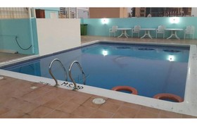 Al Commodore Suites