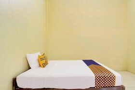 Spot On 93245 Guet House Mulia Dua Syariah