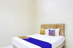 Spot On 93245 Guet House Mulia Dua Syariah