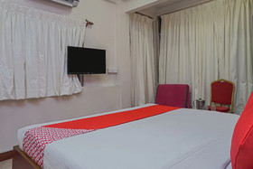 Tushar Hotels by OYO Rooms