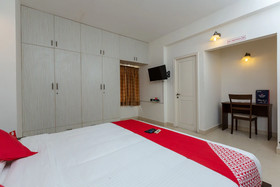 Cute Orange Service Apartments By OYO Rooms