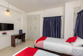Cute Orange Service Apartments By OYO Rooms
