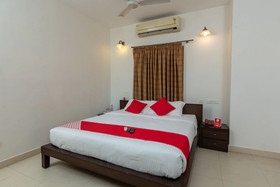Cute Orange Service Apartments By OYO Rooms
