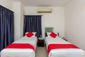 Cute Orange Service Apartments By OYO Rooms